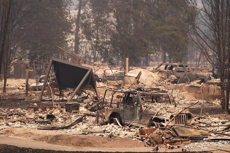 Burned-cars-sit-among-an-incinerated-neighbourhood-in-the-Old-Trails-Fire-in-Spokane-Washington-U-S-August-3-2026