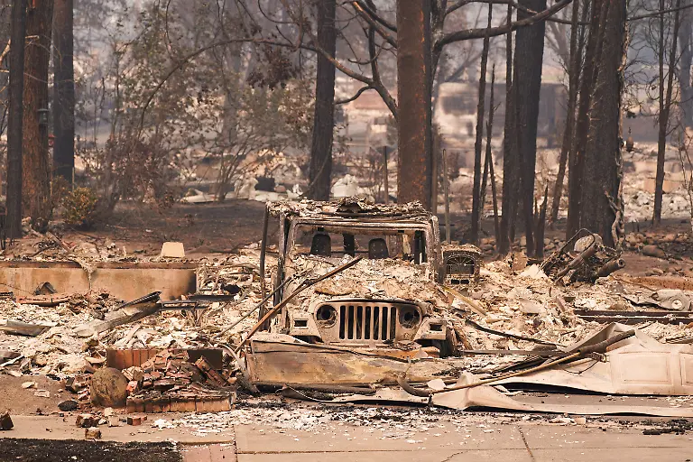A-burned-car-sits-among-an-incinerated-neighbourhood-in-the-Old-Trails-Fire-in-Spokane-Washington-U-S-August-3-2026