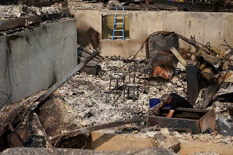 Scott-Moore-in-the-remains-of-his-house-burned-in-the-Old-Trails-Fire-in-Spokane-Washington-U-S-August-3-2026
