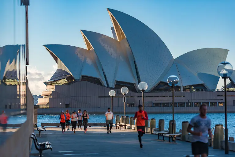 Sydney-Australia-July-23-2016-People-jogging-on-wooden-wharf-with-Sydney-Opera-House-on-the-background