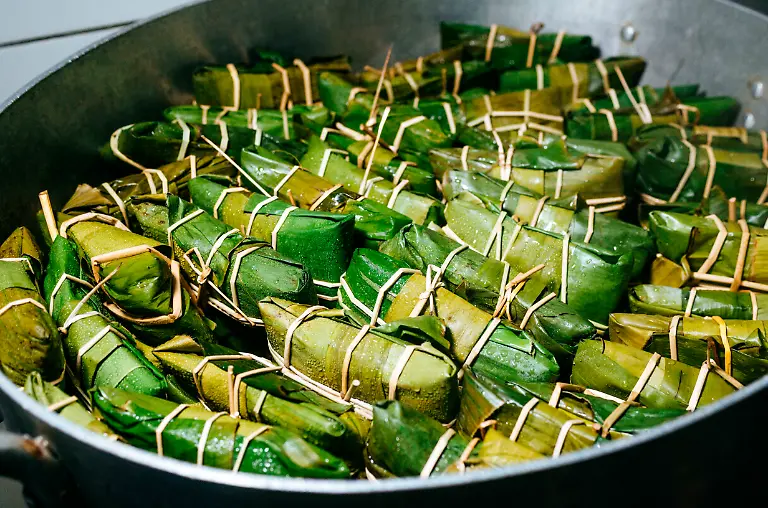 Peruvian-tamales-wrapped-in-banana-leaves-cooking-in-a-pot