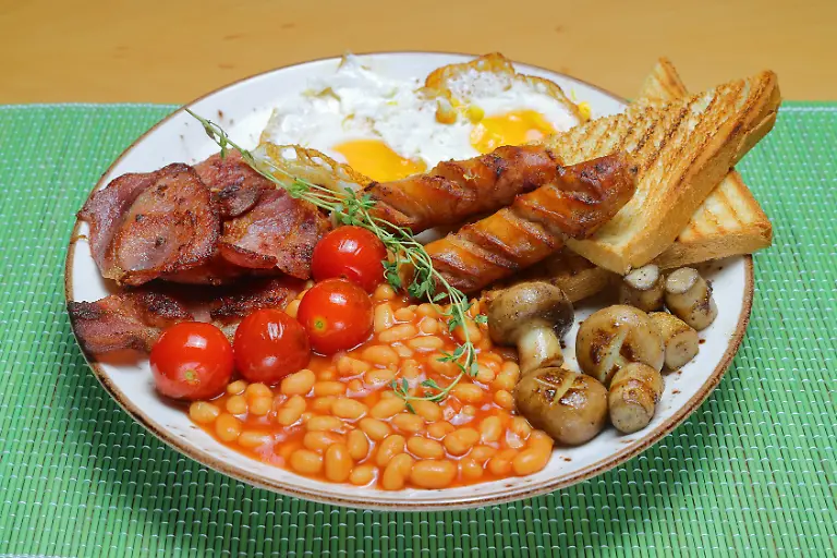 English-breakfast-toast-egg-bacon-and-vegetables-xkwx-breakfast-full-egg-bacon-food-yolk-toast-mushroom-tomato-roasted-meat-jam-orange-fried-flat-lay-copyspace-butter-knife-fork-coffee-beans-sausage-bread-cooked-fresh-black-plate-traditional-morning-calories-closeup-crispy-fat-greasy-nobody-pork-rashers-sauce-slice-unhealthy-white-juice-lunch-english
