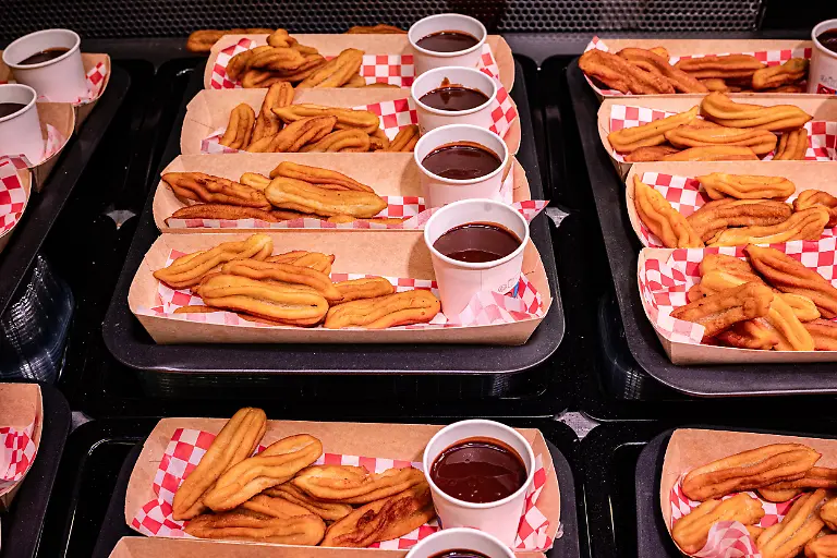 May-4-2026-Barcelona-Spain-Prepared-churros-and-porras-with-chocolate-are-displayed-for-sale-at-a-stall-inside-Barcelona-s-La-Boqueria-market-one-of-the-most-visited-food-and-drink-hotspots-in-the-Catalan-capital-City-authorities-plan-a-major-renovation-starting-this-summer-aimed-at-reducing-the-market-s-reliance-on-tourist-oriented-ready-to-eat-offerings-and-restoring-its-focus-on-fresh-local-produce