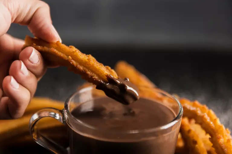 RECORD-DATE-NOT-STATED-hand-dipping-fried-churros-chocolate