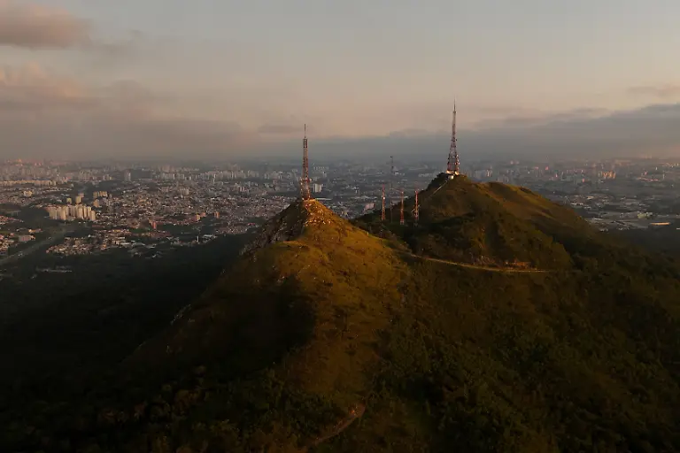 A-drone-view-shows-Jaragua-Peak-where-Indigenous-territory-and-a-state-park-are-located-as-Sao-Paulo-city-is-seen-in-the-background-Brazil-March-23-2026-The-Jaragua-Indigenous-Territory-in-the-Atlantic-Forest-is-increasingly-being-swallowed-up-by-the-Sao-Paulo-suburbs-REUTERS-Amanda-Perobelli-SEARCH-PEROBELLI-BRAZIL-BEES-FOR-THIS-STORY-SEARCH-WIDER-IMAGE-FOR-ALL-STORIES