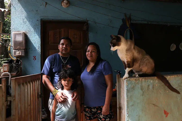Marcio-Karai-an-Indigenous-leader-and-beekeeper-his-wife-Katia-Martim-and-their-son-Nhamandu-6-pose-for-a-picture-at-their-house-in-Ytu-village-in-the-Jaragua-Indigenous-Territory-Sao-Paulo-Brazil-March-30-2026-Our-elders-are-very-concerned-about-the-disappearance-of-these-native-species-that-they-have-always-worked-with-always-had-close-at-hand-and-that-are-becoming-increasingly-scarce-today-Karai-said-REUTERS-Amanda-Perobelli-SEARCH-PEROBELLI-BRAZIL-BEES-FOR-THIS-STORY-SEARCH-WIDER-IMAGE-FOR-ALL-STORIES