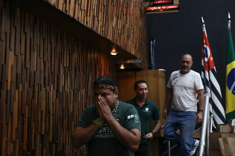 Marcio-Karai-an-Indigenous-leader-and-beekeeper-walks-off-the-stage-after-speaking-at-a-conference-about-native-bees-where-he-shared-his-knowledge-and-the-importance-of-native-bees-to-the-Guarani-Indigenous-people-in-Sao-Paulo-Brazil-November-25-2025-In-many-places-wild-pollinators-like-bees-are-threatened-with-extinction-according-to-a-major-intergovernmental-biodiversity-assessment-in-2016-Climate-change-deforestation-and-pesticides-are-the-leading-culprits-REUTERS-Amanda-Perobelli-SEARCH-PEROBELLI-BRAZIL-BEES-FOR-THIS-STORY-SEARCH-WIDER-IMAGE-FOR-ALL-STORIES