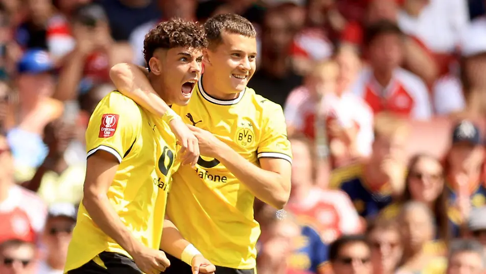 Samuele-Inacio-of-Borussia-Dortmund-left-celebrates-with-teammate-Konstantino-Karetsas-after-scoring-their-side-s-first-goal-of-the-game-Arsenal-v-Borussia-Dortmund-Pre-Season-Friendly-Football-Emirates-Stadium-London-UK-09-Aug-2026London-Emirates-Stadium-United-Kingdom-EDITORIAL-USE-ONLY-No-use-with-unauthorised-audio-video-data-fixture-lists-club-league-logos-or-live-services-Online-in-match-use-limited-to-120-images-no-video-emulation-No-use-in-betting-games-or-single-club-league-player-publications