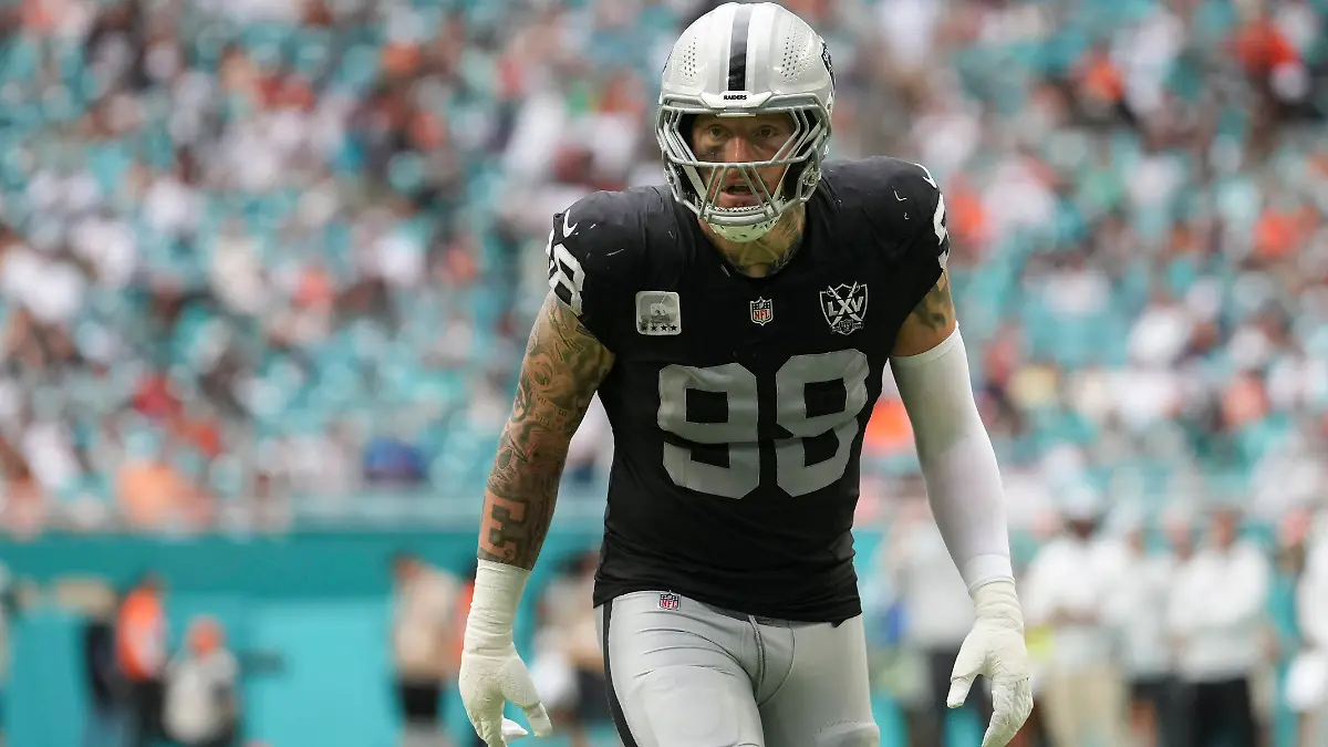MIAMI-GARDENS-FL-NOVEMBER-17-Las-Vegas-Raiders-defensive-end-Maxx-Crosby-98-eyes-the-passer-before-a-play-during-the-game-between-the-Las-Vegas-Raiders-and-the-Miami-Dolphins-on-Sunday-November-17-2024-at-Hard-Rock-Stadium-in-Miami-Gardens-Fla