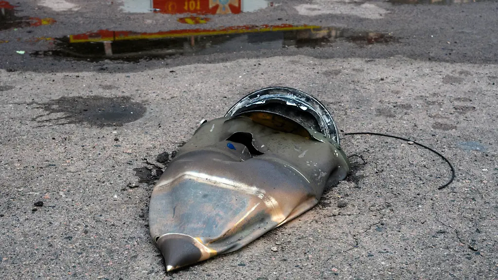 Part-of-a-Russian-ballistic-missile-lies-near-the-site-of-a-strike-on-a-food-warehouse-in-Kyiv-Ukraine-on-August-5-2026-Overnight-Russia-launched-28-ballistic-missiles-at-Kyiv-and-the-Kyiv-region-killing-17-people-and-injuring-dozens-Civilian-infrastructure-including-warehouses-of-major-retail-chains-and-logistics-centers-was-damaged-sparking-large-fires