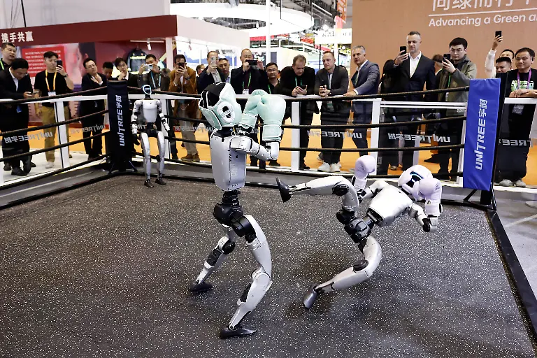 SHANGHAI-CHINA-NOVEMBER-05-Unitree-G1-humanoid-robots-engage-in-a-boxing-match-during-the-8th-China-International-Import-Expo-at-the-National-Exhibition-and-Convention-Center-Shanghai-on-November-5-2025-in-Shanghai-China-The-eighth-CIIE-and-Hongqiao-International-Economic-Forum-opened-here-on-Wednesday