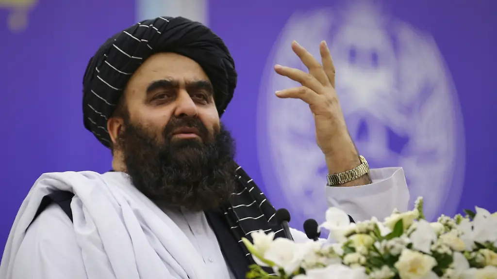 Taliban-s-Foreign-Minister-Amir-Khan-Muttaqi-left-addresses-delegates-from-across-Afghanistan-during-a-meeting-marking-the-start-of-celebrations-of-the-fourth-anniversary-of-the-U-S-withdrawal-and-the-start-of-Taliban-rule-at-Loya-Jirga-Hall-in-Kabul-Friday-Aug-15-2025