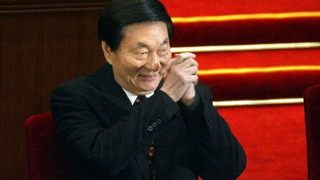 Outgoing-Chinese-premier-Zhu-Rongji-gestures-toward-delegates-during-a-National-People-s-Congress-session-at-the-Great-Hall-of-the-People-in-Beijing-16-March-2003-The-retiring-Zhu-was-replaced-16-March-by-new-Premier-Wen-Jiabao-cemeting-the-transition-to-a-younger-leadership-following-the-election-of-Hu-Jinato-as-president-15-March-AFP-PHOTO-Frederic-J