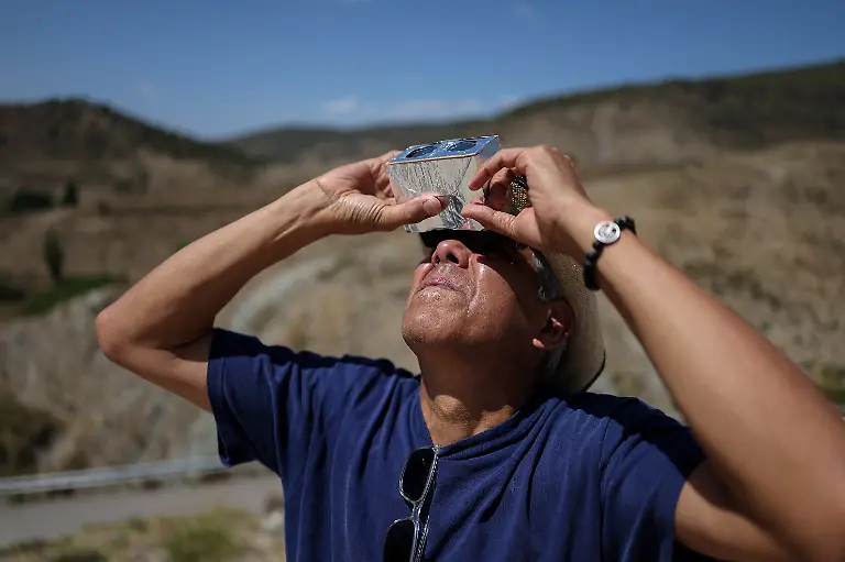 Cesar-Gadea-from-Miami-Florida-U-S-looks-at-the-sun-through-self-made-binoculars-ahead-of-a-total-solar-eclipse-at-the-Galactica-Centre-near-the-Javalambre-Astrophysical-Observatory-in-Arcos-de-las-Salinas-near-Teruel-Spain-August-12-2026