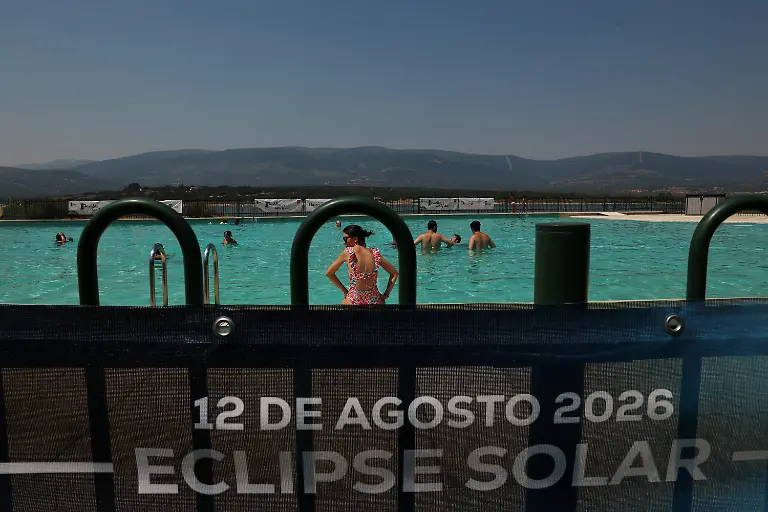 People-bathe-in-a-pool-as-they-attend-an-eclipse-watch-party-on-the-day-of-a-total-solar-eclipse-in-Buitrago-del-Lozoya-Spain-August-12-2026