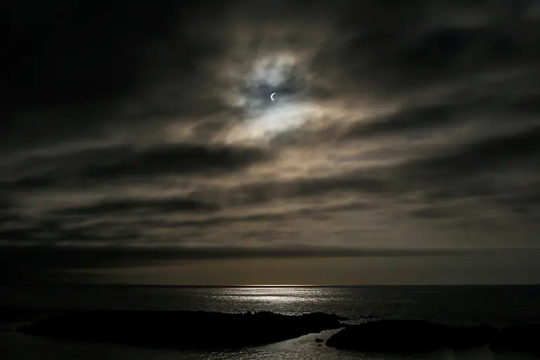 The-moon-partially-covers-the-sun-during-a-solar-eclipse-as-seen-from-A-Coruna-Spain-August-12-2026