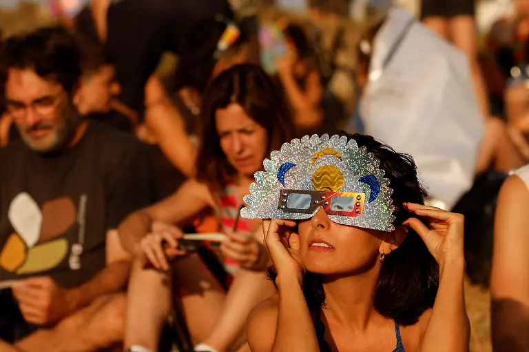 A-person-uses-self-made-artefacts-to-observe-a-solar-eclipse-before-totality-near-the-small-village-of-Castell-de-Cabres-Spain-August-12-2026