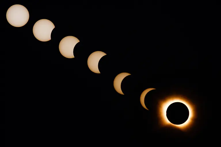 A-composite-image-of-seven-separate-photographs-taken-with-a-single-fixed-camera-shows-stages-of-a-solar-eclipse-before-during-and-after-totality-as-seen-from-Arija-Spain-August-12-2026