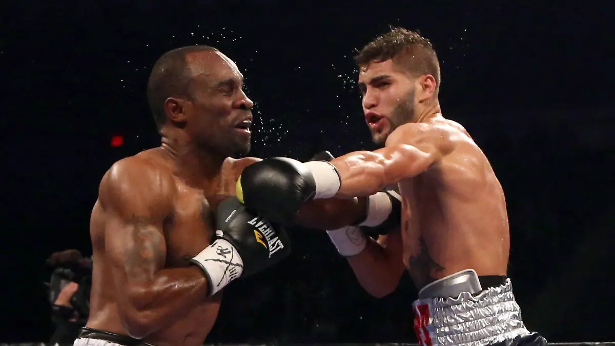 Prichard-Colon-right-punches-Vivian-Harris-during-their-WBC-welterweight-boxing-match-Friday-Sept-11-2015-in-Toronto