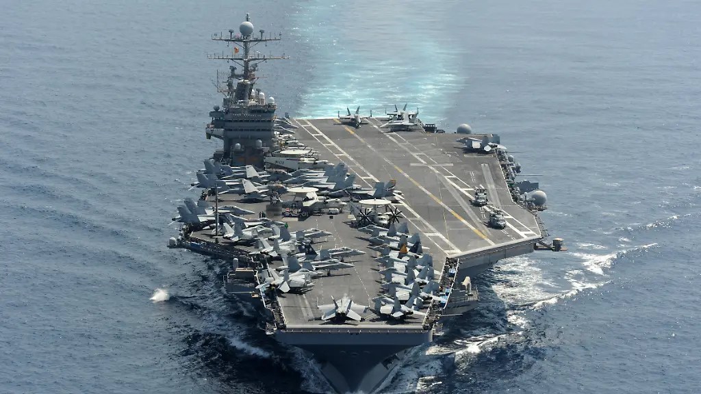 Handout-photo-dated-January-18-2012-of-the-Nimitz-class-aircraft-carrier-USS-Abraham-Lincoln-CVN-72-transits-the-Indian-Ocean-The-US-is-sending-a-carrier-strike-group-a-fighter-squadron-and-additional-warships-to-the-Middle-East-as-the-region-braces-for-an-Iranian-retaliation-to-the-killing-of-a-senior-Hamas-leader-in-Tehran-earlier-this-week-On-Friday-August-2-2024-Defense-Secretary-Lloyd-Austin-ordered-the-USS-Abraham-Lincoln-strike-group-to-replace-the-USS-Theodore-Roosevelt-strike-group-which-is-currently-operating-in-the-Gulf-of-Oman-according-to-a-statement-from-Pentagon-deputy-press-secretary-Sabrina-Singh-U-S-Navy-photo-by-Chief-Mass-Communication-Specialist-Eric-S-Powell-via-ABACAPRESS