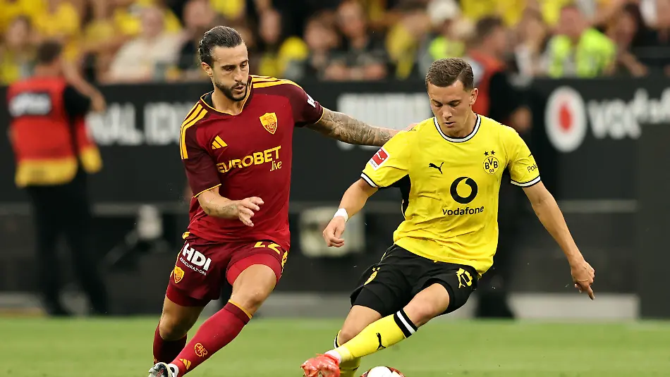 DORTMUND-GERMANY-AUGUST-15-Konstantinos-Karetsas-of-Borussia-Dortmund-is-put-under-pressure-from-Mario-Hermoso-of-AS-Roma-during-the-pre-season-friendly-match-between-Borussia-Dortmund-and-AS-Roma-at-Signal-Iduna-Park-on-August-15-2026-in-Dortmund-Germany