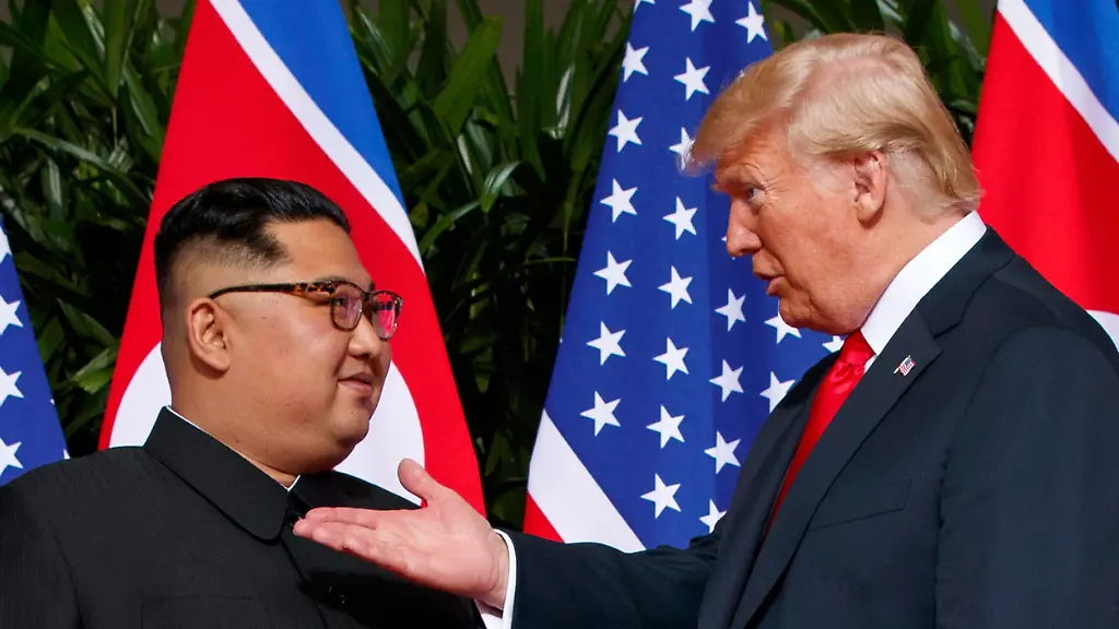 FILE-U-S-President-Donald-Trump-right-meets-with-North-Korean-leader-Kim-Jong-Un-on-Sentosa-Island-in-Singapore-on-June-12-2018