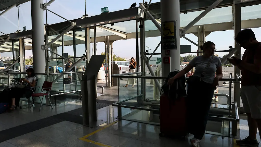 Passengers-wait-inside-the-terminal-at-Vincenzo-Bellini-Catania-Airport-following-the-closure-of-the-airport-due-to-an-ash-cloud-from-Sicily-s-Mount-Etna-eruption-in-Catania-Italy-August-14-2026