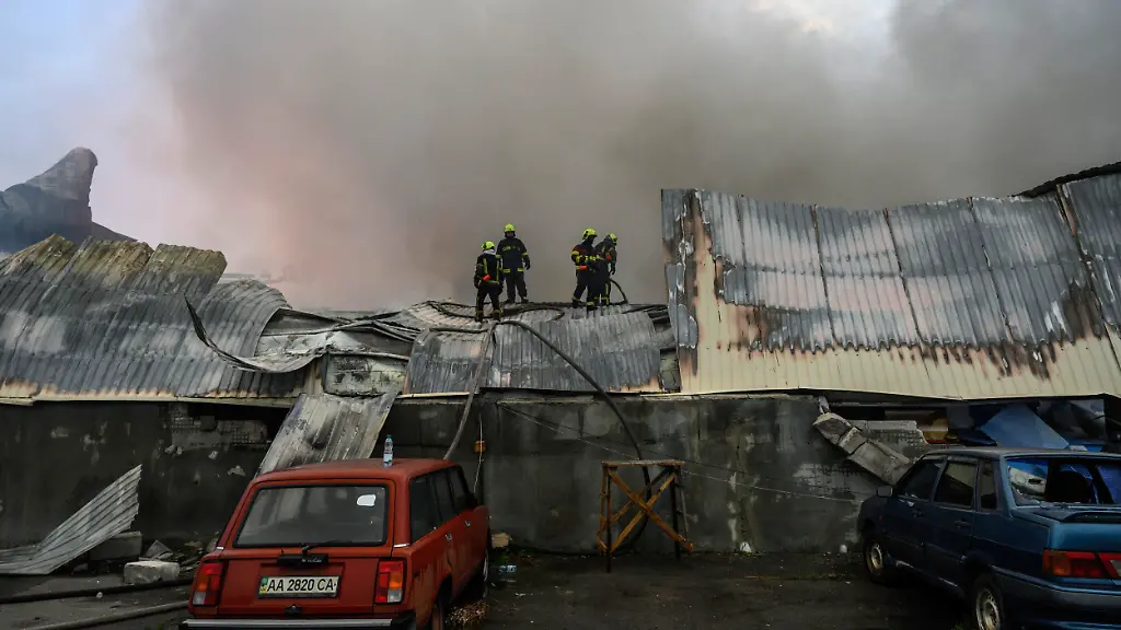 Firefighters-work-to-extinguish-a-fire-at-a-large-food-warehouse-in-Kyiv-Ukraine-on-August-5-2026-Overnight-Russia-launched-28-ballistic-missiles-at-Kyiv-and-the-Kyiv-region-killing-17-people-and-injuring-dozens-Civilian-infrastructure-including-warehouses-of-major-retail-chains-and-logistics-centers-was-damaged-sparking-large-fires
