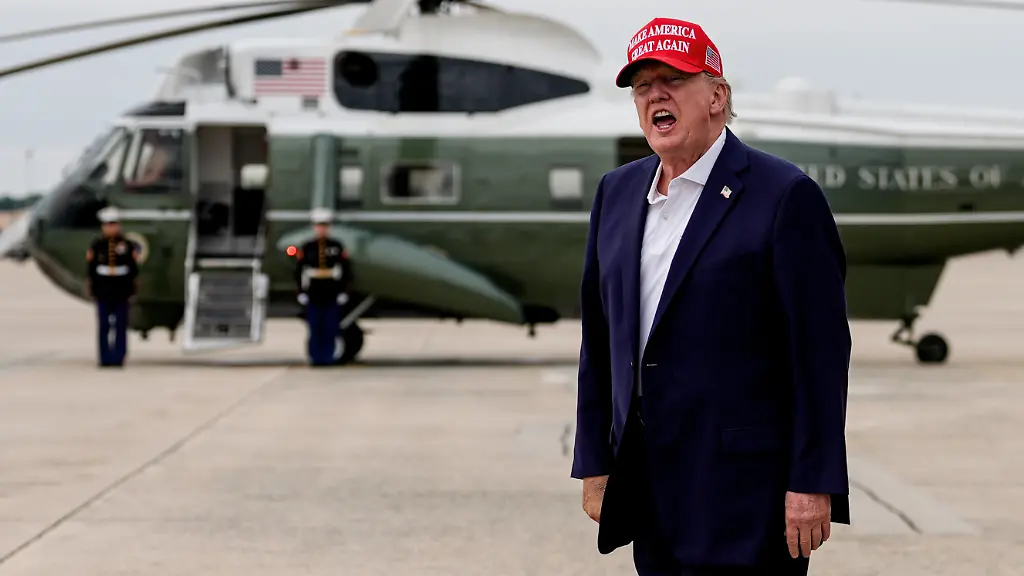President-Donald-Trump-yells-to-reporters-after-disembarking-Air-Force-One-Sunday-Aug-16-2026-at-Joint-Base-Andrews-Md