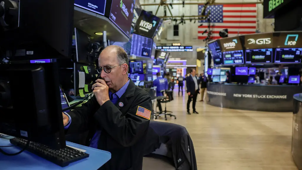 A-trader-works-on-the-floor-of-the-New-York-Stock-Exchange-NYSE-in-New-York-City-U-S-August-5-2026