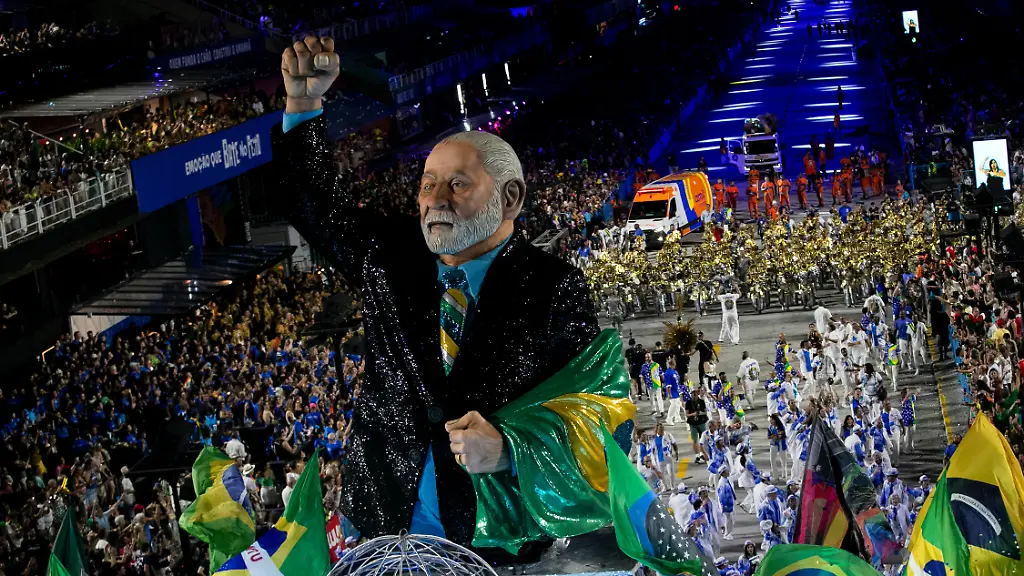 Performers-from-the-Academicos-de-Niteroi-samba-school-parade-on-a-float-with-a-sculpture-of-President-Luiz-Inacio-Lula-da-Silva-during-Carnival-celebrations-at-the-Sambadrome-in-Rio-de-Janeiro-Sunday-Feb-15-2026