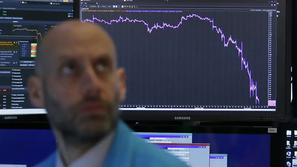 Traders-work-on-the-the-floor-of-the-New-York-Stock-Exchange-at-the-opening-bell-on-Wall-Street-in-New-York-City-on-Tuesday-March-17-2020-Tuesday-s-trading-contiuned-its-volatile-and-markets-are-still-reeling-from-the-Coronavirus-pandemic
