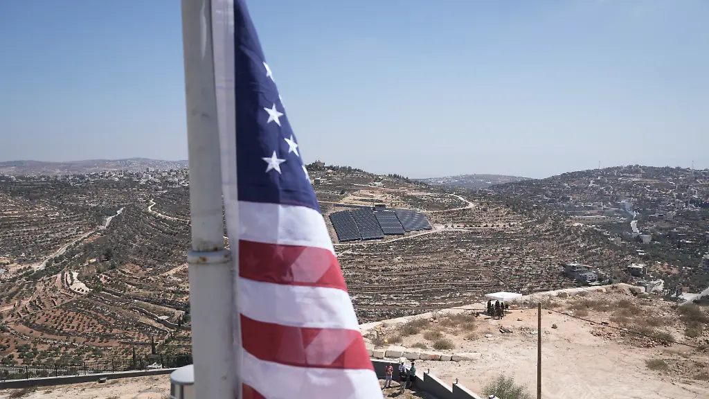 The-U-S-flag-is-raised-on-the-roof-of-Ohio-based-Palestinian-American-landlord-Loui-Ridi-s-home-which-has-been-besieged-by-Israeli-settlers-for-over-a-week-in-the-occupied-West-Bank-village-of-Qusra-south-of-Nablus-Wednesday-Aug-19-2026