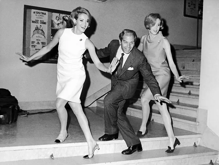 Italian-actor-Enrico-Maria-Salerno-and-the-two-German-twin-sisters-dancers-actresses-Alice-and-Ellen-Kessler-rehearse-a-scene-of-a-new-musical-show-on-April-7-1967-aViol-violin-and-love-viola-which-is-prepared-in-Rome-Italy-The-text-is-by-the-two-well-known-Italian-scriptwriters-Garinei-and-Giovannini-with-music-by-Armando-Trovaioli-The-starring-roles-are-played-by-Salerno-who-is-at-his-first-attempt-in-a-stage-performance-and-by-the-two-twin-sisters-Salerno-is-the-violin-Miss-Alice-is-the-viol-his-shrewd-wife-while-the-love-violin-Miss-Ellen-is-an-invention-or-imagination-by-Salerno-perfectly-resembling-the-wife-but-of-a-completely-different-and-lovely-character