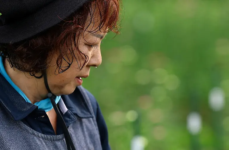 Miyoko-Asada-68-an-employee-at-the-Nikko-Engei-flower-farm-harvests-asters-as-sweat-drips-from-her-face-in-a-field-in-Nikko-Tochigi-Prefecture-Japan-August-9-2026-REUTERS-Issei-Kato-SEARCH-KATO-JAPAN-FARMERS-FOR-THIS-STORY-SEARCH-WIDER-IMAGE-FOR-ALL-STORIES