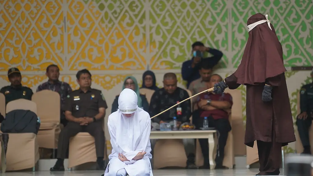 Eleven-people-convicted-under-Aceh-s-Qanun-on-Islamic-Criminal-Law-Jinayat-receive-caning-sentences-at-the-Taman-Sari-Bustanussalatin-Stage-in-Banda-Aceh-The-sentences-are-carried-out-in-public-as-part-of-the-court-ordered-punishment