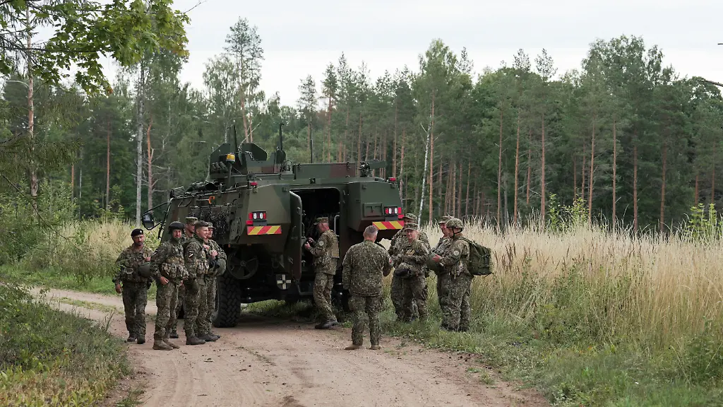 Servicemen-of-the-Latvian-National-Guard-gather-before-a-search-operation-for-the-debris-from-an-intercepted-drone-amid-Russia-s-attack-on-Ukraine-in-Rugaji-Latvia-August-14-2026