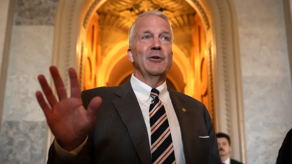 Sen-Dan-Sullivan-R-Alaska-speaks-to-reporters-as-Republicans-begin-a-final-push-to-advance-President-Donald-Trump-s-tax-breaks-and-spending-cuts-package-at-the-Capitol-in-Washington-Monday-June-30-2025
