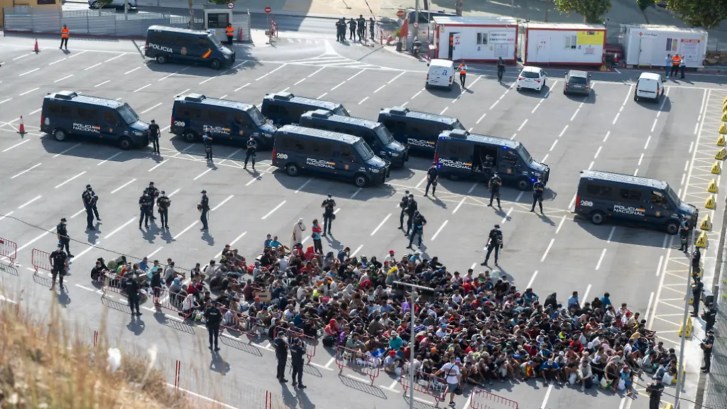 Police-Clear-Trampolin-Beach-in-Ceuta-Migrants-cleared-from-Trampolin-Beach-are-on-their-way-to-be-relocated-August-20-2026-in-Ceuta-Spain-Police-have-begun-to-clear-the-makeshift-migrant-camp-on-Trampolin-Beach-in-Ceuta