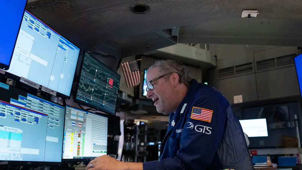 Specialist-Gregg-Maloney-works-on-the-floor-of-the-New-York-Stock-Exchange-Monday-Aug-17-2026-in-New-York