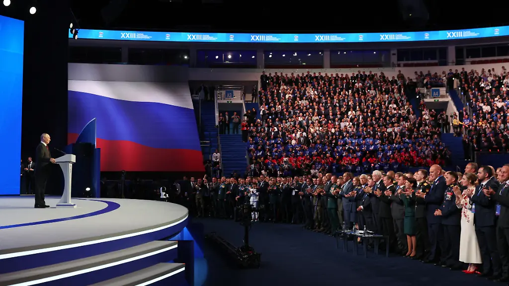 EDITORS-NOTE-Graphic-content-In-this-pool-photograph-distributed-by-the-Russian-state-agency-Sputnik-Russian-President-Vladimir-Putin-L-speaks-at-the-second-stage-of-the-23rd-Congress-of-the-United-Russia-party-at-the-Megasport-Arena-in-Moscow-on-August-22-2026