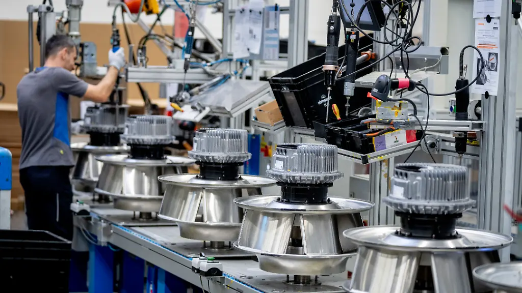 A-man-works-on-fans-at-an-EBM-Papst-plant-in-Hollenbach-Germany-Tuesday-Feb-4-2025