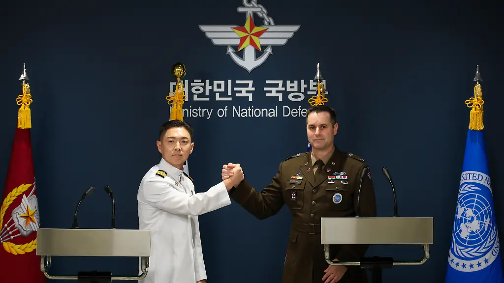Col-Jang-Do-young-L-public-affairs-director-of-South-Korea-s-Joint-Chiefs-of-Staff-and-U-S-Army-Col-Ryan-Donald-public-affairs-director-of-the-United-Nations-Command-Combined-Forces-Command-and-United-States-Forces-Korea-shake-hands-during-a-joint-press-briefing-on-the-2026-Freedom-Shield-FS-exercise-at-the-Ministry-of-National-Defense-in-Seoul-South-Korea-on-August-10-2026