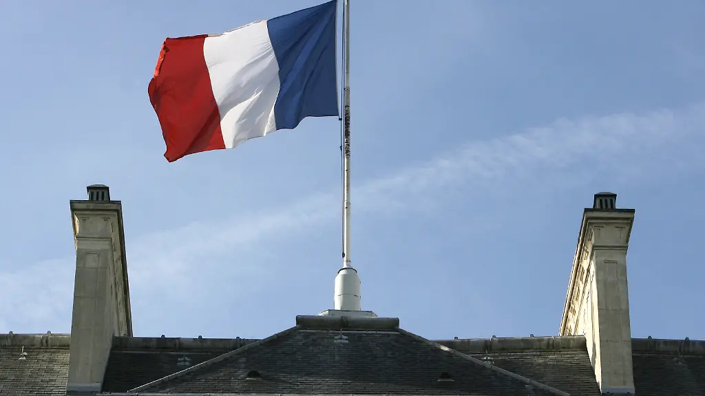 A-photo-showing-the-French-flag-flying-over-the-Elysee-palace-the-official-residence-of-the-French-President-17-October-2006-in-Paris