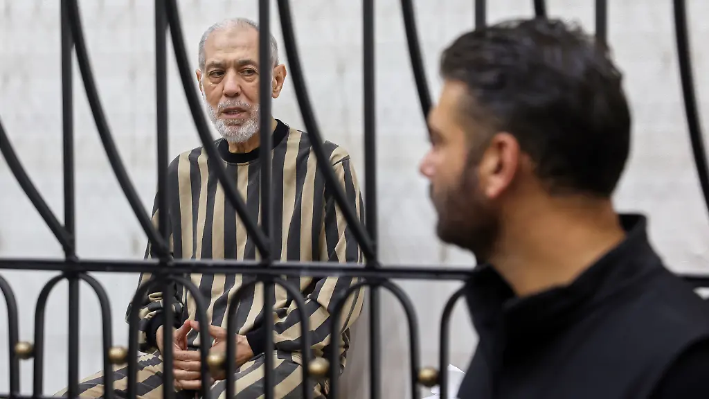 Syria-s-former-grand-mufti-under-ousted-President-Bashar-Assad-Ahmad-Badreddine-Hassoun-sits-in-the-defendants-cage-before-a-court-sentences-him-to-life-in-prison-at-the-Palace-of-Justice-in-Damascus-Syria-Monday-Aug-24-2026