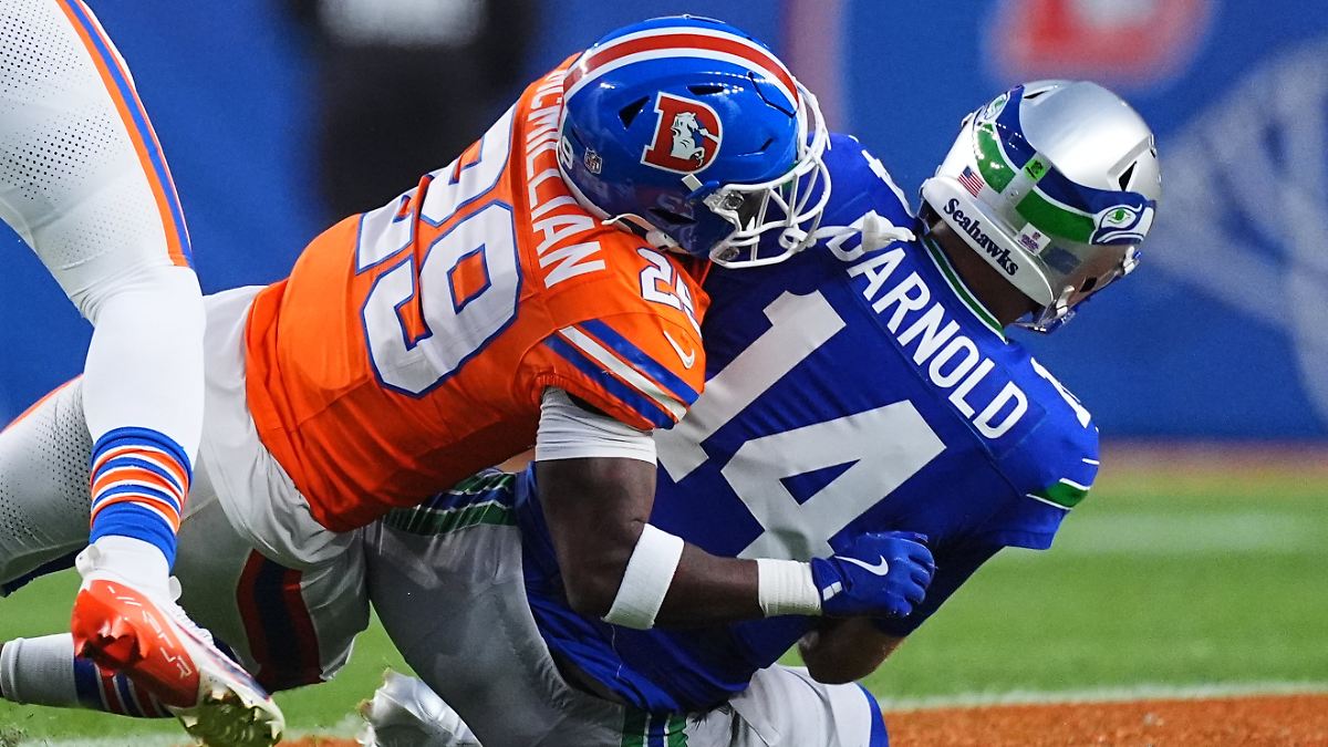 NFL Game Report: Denver plunges champion Seattle into defensive battle