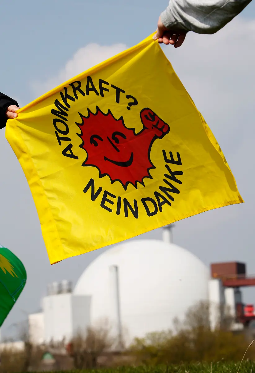 Supporters-and-activists-of-the-anti-nuclear-power-movement-line-up-for-a-human-chain-in-front-of-the-nuclear-power-plant-in-Brokdorf-northern-Germany-Saturday-April-24-2010-According-to