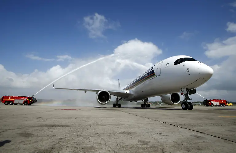 The-first-of-67-new-Airbus-A350-900-planes-delivered-to-Singapore-Airlines-is-greeted-with-a-water-cannon-salute-on-arrival-at-Singapore-s-Changi-Airport-March-3-2016