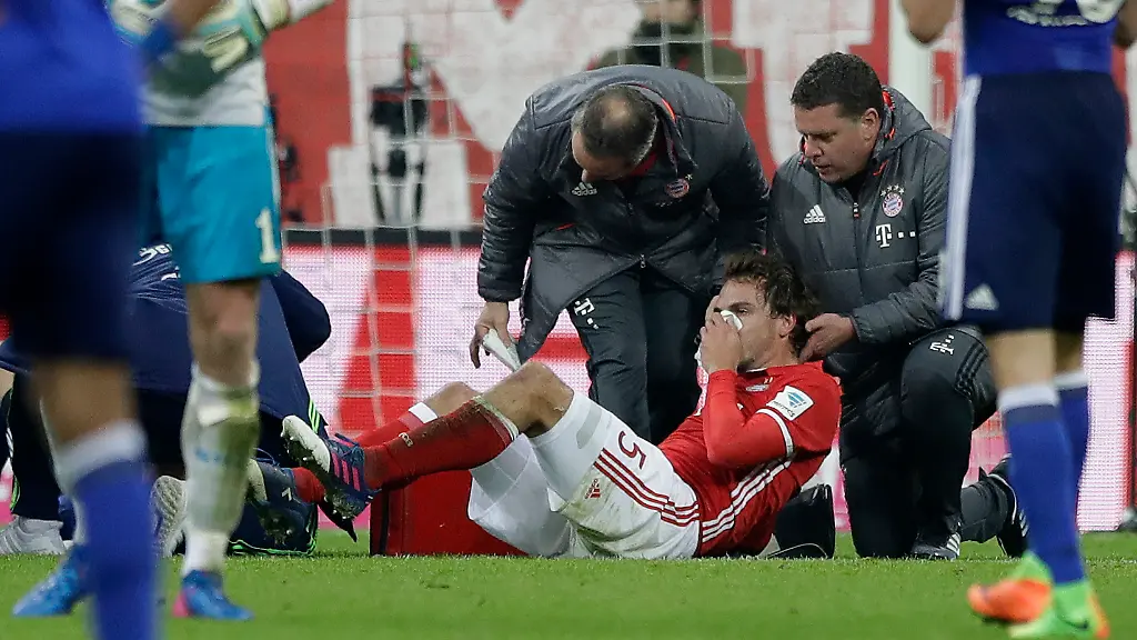 Bayern-s-Mats-Hummels-sits-injured-on-the-ground-during-the-German-Bundesliga-soccer-match-between-FC-Bayern-Munich-and-FC-Schalke-04-at-the-Allianz-Arena-stadium-in-Munich-Germany-Saturday-Feb-4-2017