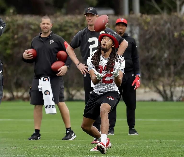 Atlanta-Falcons-cornerback-Jalen-Collins-32-fields-a-ball-in-front-of-quarterback-Matt-Ryan-2-during-a-practice-for-the-NFL-Super-Bowl-51-football-game-Friday-Feb-3-2017-in-Houston-Atlanta-will-face-the-New-England-Patriots-in-the-Super-Bowl-Sunday